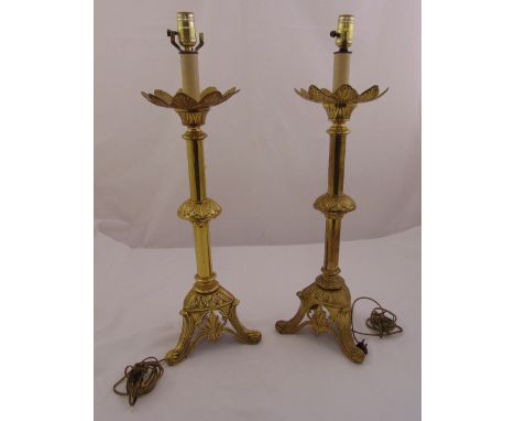 A pair of brass lamp stands of knopped tubular form on pierced triform bases, 74cm (h)