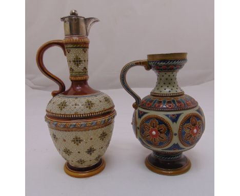 A Mettlach ceramic wine ewer with hallmarked silver spout and hinged cover and a matching water jug, ewer 24cm (h) jug 18cm (