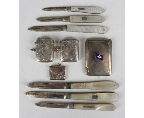 An Edwardian silver envelope 'Stamps' case, Birmingham 1902, length 2.8cm, two silver vesta cases, each with engraved decorat