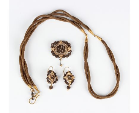 A Victorian gold and woven hair work brooch, detailed 'Eva G. Hawley 1870', width 3.8cm, with a matching pair of earrings wit