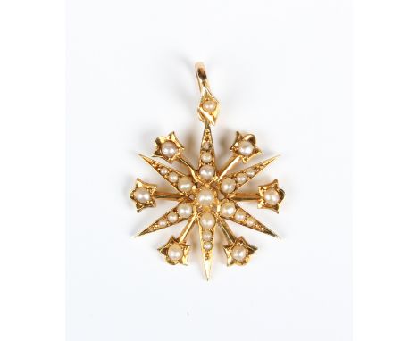 An Edwardian gold and seed pearl pendant, designed as a six pointed starburst with floral divisions, detailed '15ct', weight 