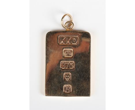 A 9ct gold rectangular ingot shaped pendant, London 1976, weight 32.1g, length 4.8cm.Buyer’s Premium 29.4% (including VAT @ 2