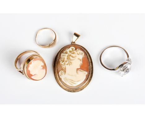 A gold mounted oval shell cameo pendant, carved as a portrait of a lady, unmarked, weight 8.5g, length 4.3cm, a 9ct gold and 