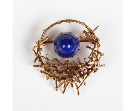 A gold and lapis lazuli brooch in an abstract design, detailed '585 WB', weight 7.9g, width 3.2cm.Buyer’s Premium 29.4% (incl