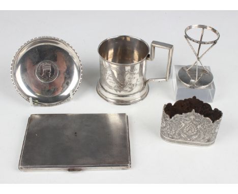 A small group of silver, comprising a cigarette case, Birmingham 1938, length 12.4cm, a golf trophy, Birmingham 1926 by Elkin