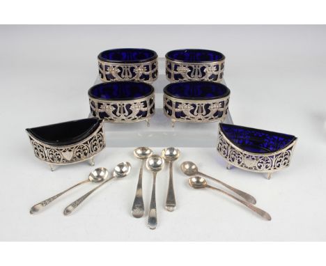 A set of four 19th century French silver oval salts, each embossed and pierced with cornucopia, lyres and anthemion united by