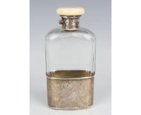 A George V silver, cut glass and ivory hip flask, the facet cut glass with silver detachable cap, the silver collar and screw