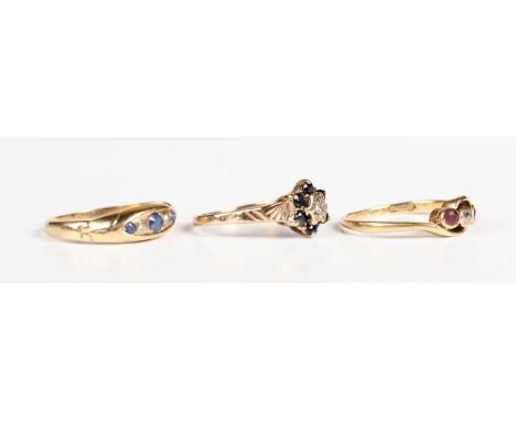 An 18ct gold, ruby and diamond three stone ring in a crossover design, Birmingham 1930, ring size approx K1/2, an 18ct gold, 