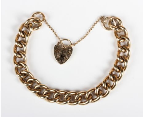 A 9ct gold solid curblink bracelet on a 9ct gold heart shaped padlock clasp, fitted with a safety chain, weight 57.7g, length