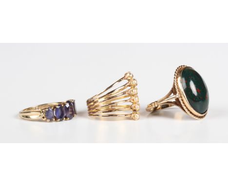 A gold and iolite five stone ring, detailed '9K', ring size approx L, a gold ring, collet set with an oval cabochon bloodston