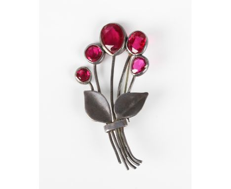 A silver and synthetic ruby five stone brooch, designed as a floral spray, detailed 'Silver', weight 16g, width 7.1cm.Buyer’s