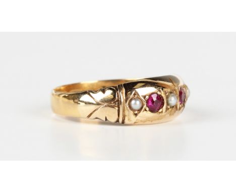 A gold, half-pearl and red gem set ring, mounted with two cushion cut red gemstones alternating with three half-pearls, weigh