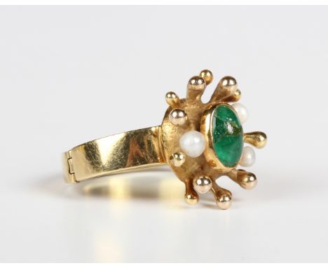 An 18ct gold, emerald and cultured pearl ring, mounted to the centre with a cabochon emerald and three cultured pearls in an 