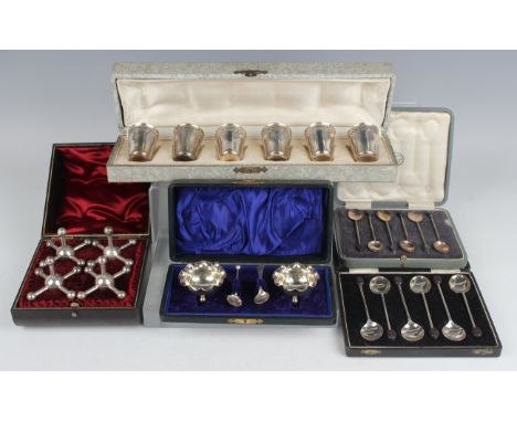 A set of six early 20th century French silver shot measures, weight 42.7g, cased, together with a small collection of other s