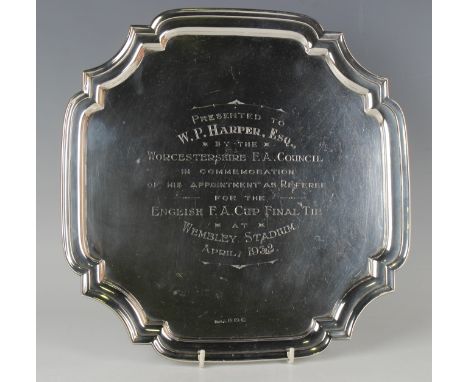 A George V silver salver with shaped rim, the centre with engraved presentation inscription 'Presented to W. P Harper, Esq., 