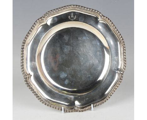 An Edwardian silver plate with shaped gadrooned rim and engraved Marling family crest, London 1908 by Daniel &amp; John Wellb