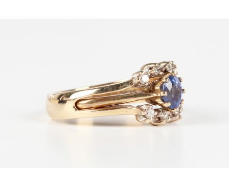 A 9ct gold ring, claw set with an oval cut sapphire, London 1993, weight 1.3g, ring size approx M1/2, interfitting with a gol