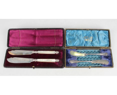 A pair of Victorian silver and mother-of-pearl handled butter knives, Sheffield 1885, cased, together with a pair of silver b