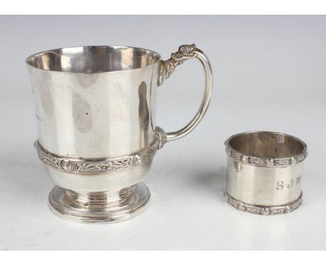 A George VI silver christening tankard, decorated with a Celtic band, height 9cm, on a circular foot, engraved with an inscri