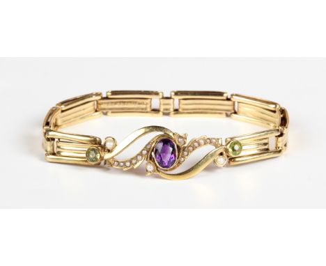 A gold, amethyst, peridot and seed pearl bracelet, the front in a scroll pierced design, otherwise in an expanding bar link d