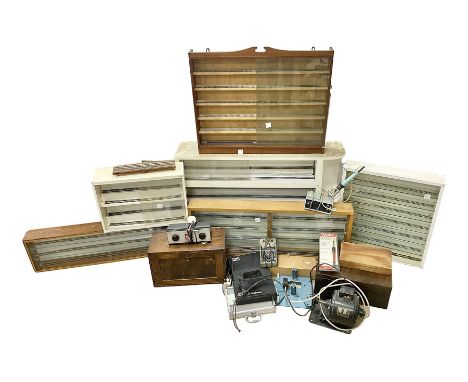 Six shelved cabinets for displaying ‘00’ gauge locomotives comprising plain plywood and white painted examples with track app