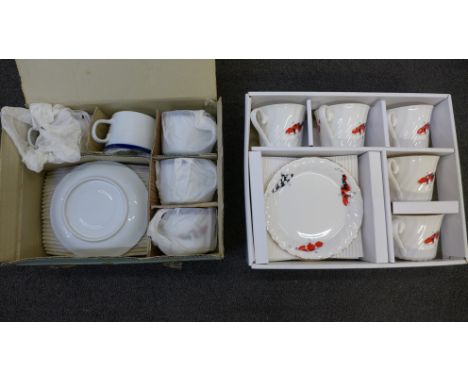 A Japanese Koi carp decorated porcelain tea service and one other similar tea service 