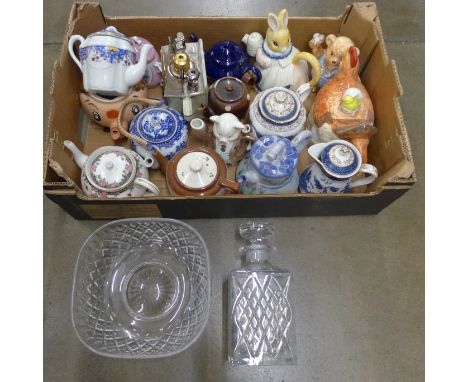 A collection of tea pots including some in the form of animals, a cut glass bowl and a cut glass decanter, one teapot by Swin