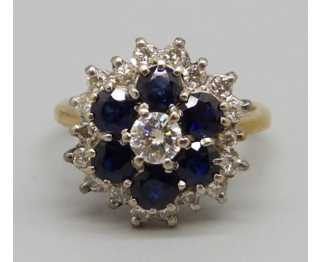 An 18ct gold, sapphire and diamond cluster ring, 6.5g, O, nineteen diamonds approximately 1ct weight, plus six sapphires 