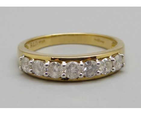 An 18ct gold, seven stone diamond ring, approximately 0.75ct diamond weight, 3.5g, P 