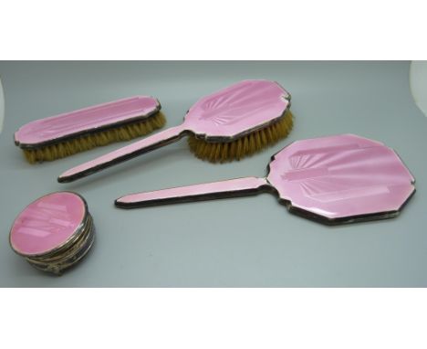 A silver and pink enamel hand mirror, two brushes and a trinket pot, a/f 
