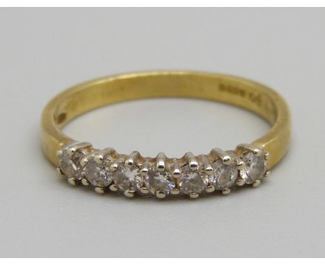 An 18ct gold, seven stone diamond ring, 2.1g, K 