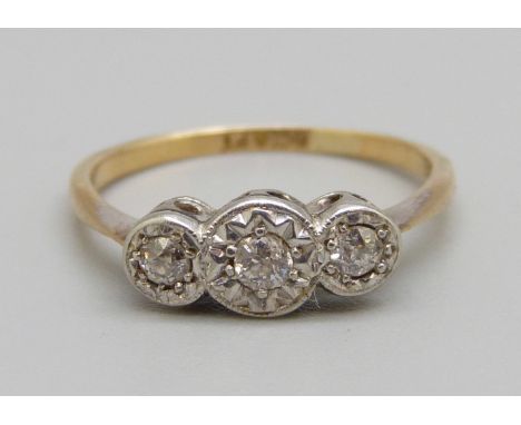 An 18ct gold, platinum set three stone diamond ring, 2.4g, L 