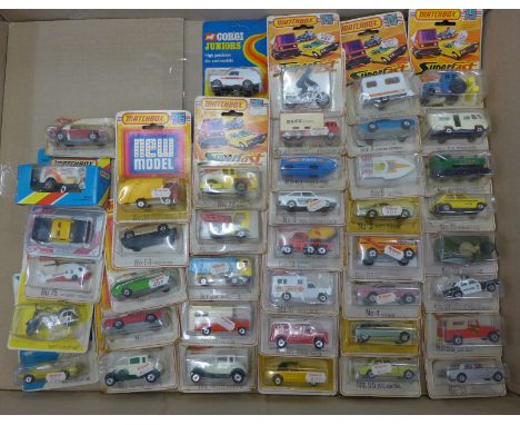 A collection of Matchbox and Corgi model vehicles, boxed 