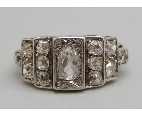 A 1920's Art Deco thirteen stone diamond ring, 2.8g, L, 0.50ct centre stone, total diamond weight approximately 1.2ct, set in
