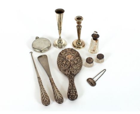A late Victorian silver handled button hook and shoe horn, London 1897; a silver backed hand mirror with profuse foliate scro