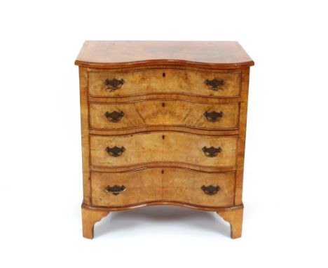 A good quality walnut and cross-banded serpentine fronted chest, of four long drawers, raised on bracket feet, 78cm wide