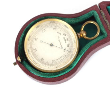 A gilded brass pocket barometer, in leather folding outer case