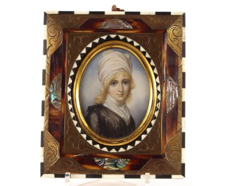 A 19th Century oval portrait miniature, of a young girl with white silk headdress, bears indistinct initials, 6.6cm x 5cm, co