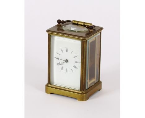 A Victorian brass carriage clock, dated 14th February 1880, complete with key, 13cm high