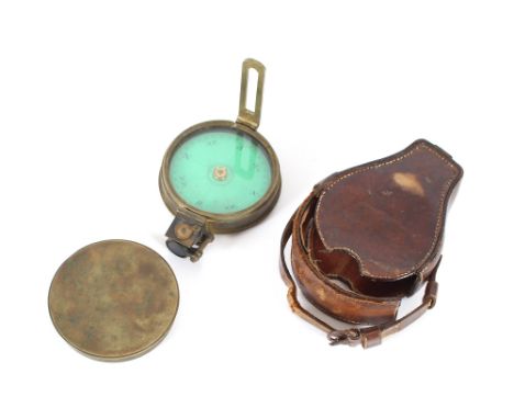A leather cased brass compass