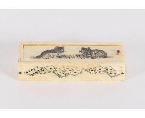 An early 19th Century carved bone miniature set of dominoes, contained in a case, the lid decorated with cats playing dominoe