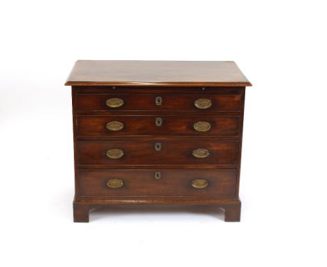 A George III mahogany chest, fitted four long graduated drawers beneath a brushing slide, raised on bracket feet, 100cm wide