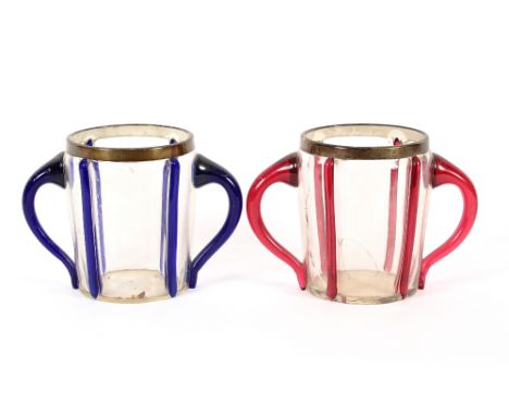 A pair of Art Deco blue and ruby glass decorated twin handled wine coolers, having silver mounts, hallmarked for London 1927,