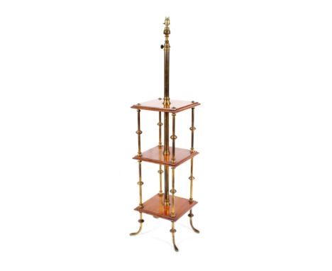 A mahogany and brass three tier standard lamp, with adjustable central coloumn, each tier raised on turned supports, terminat