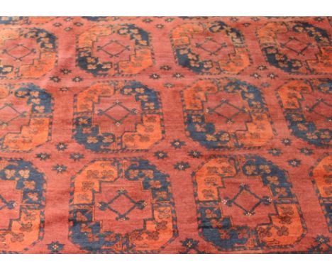 A small Afghan Bokhara carpet, 331cm x 232cm