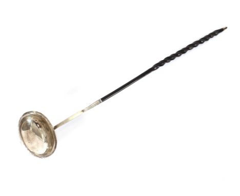A Georgian white metal Toddy ladle, having whalebone twist handle