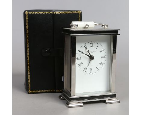 A cased quartz carriage clock by The London Clock Company.