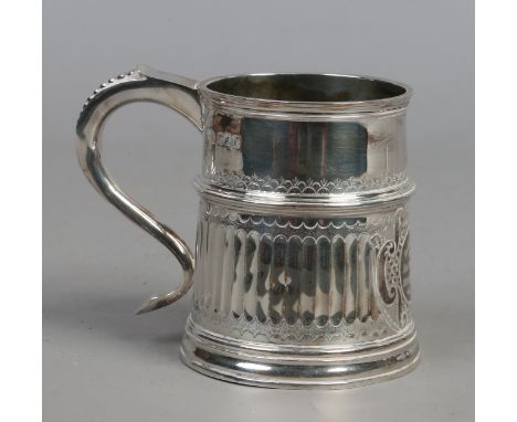 A Britannia silver christening tankard with scrolling handle and fluted moulding, assayed London 1912, 247 grams.