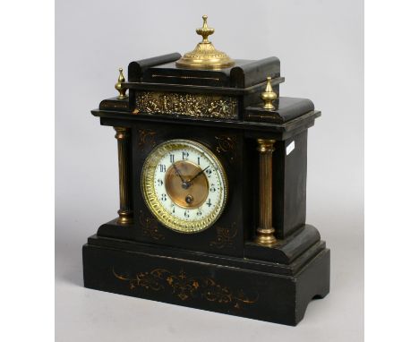 A large slate mantel clock with gilt decoration, pendulum and key.