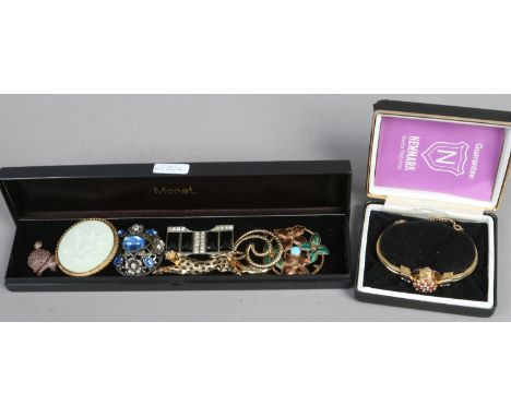 A collection of vintage costume jewellery brooches including Royal Worcester and a jet and paste Art Deco brooch along with a